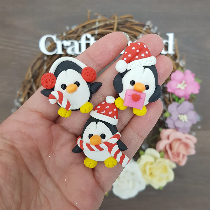 Christmas penguins - Embellishment Clay Bow Centre