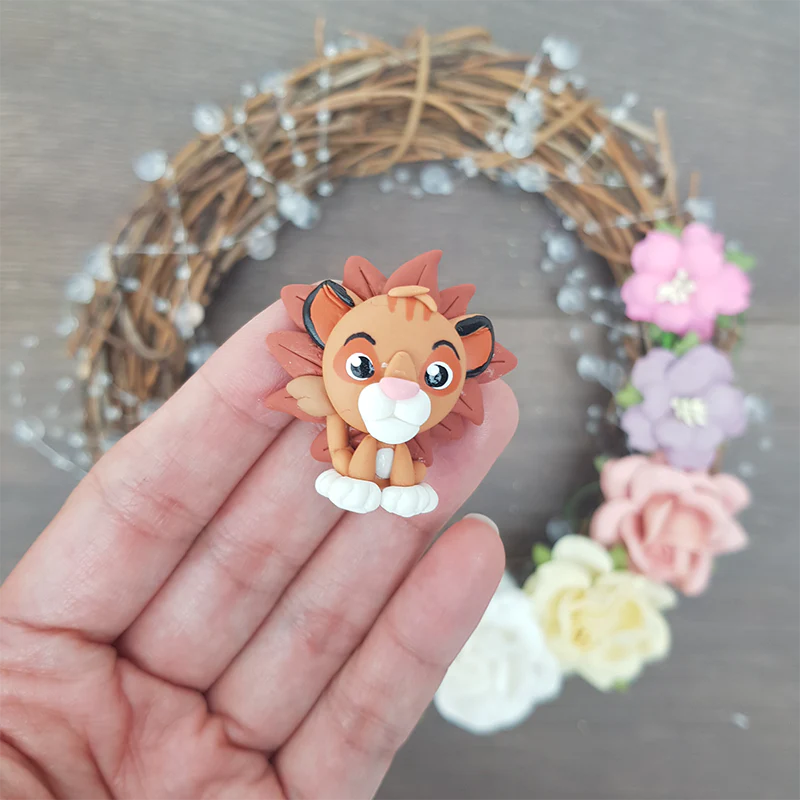 Young lion - Handmade Flatback Clay Bow Centre - Image 2